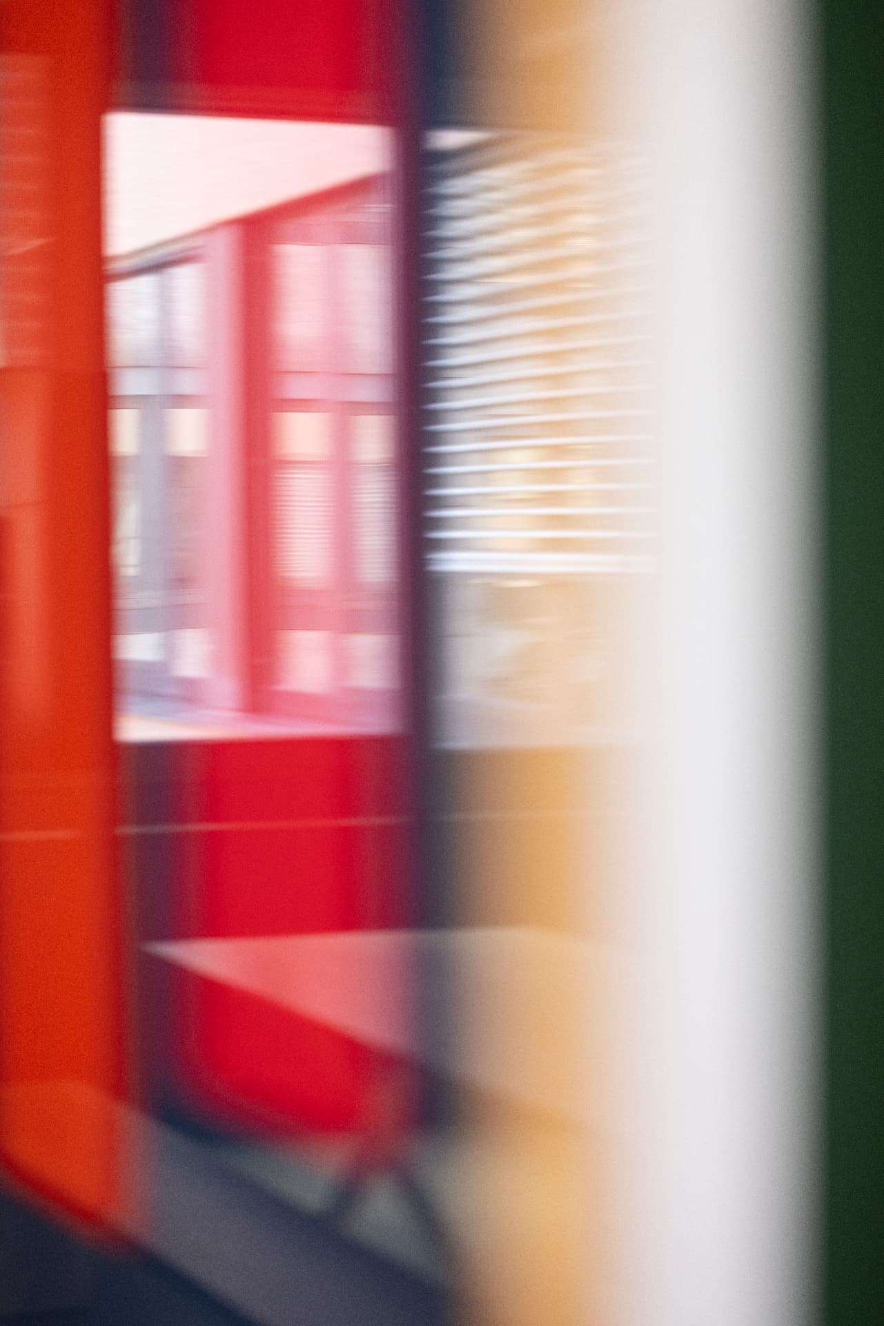 Blurred motion image of a red corridor with light stripes